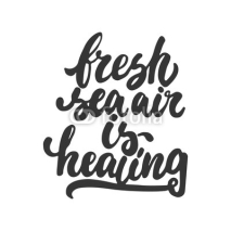 Naklejki Fresh sea air is healing - hand drawn lettering phrase isolated on the white background. Fun brush ink inscription for photo overlays, greeting card or t-shirt print, poster design.