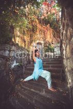 woman practice yoga on old stairs outdoor