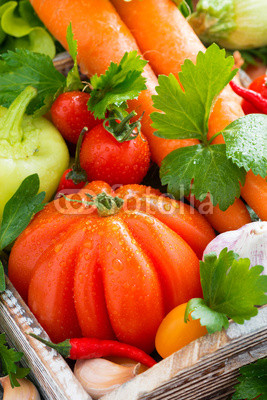harvest seasonal vegetables in a wooden box, close-up