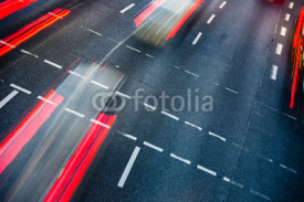Naklejki Motion blurred city road traffic (color toned  image)