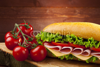 big sandwich with ham, cheese and vegetables