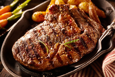 Serving of grilled steak with potatoes