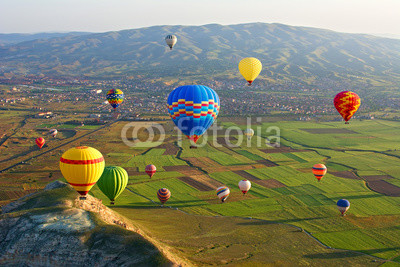 Cappadocia. Colorful hot air balloons flying over the valley at