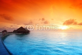 Obrazy i plakaty maldivian houses on sunrise