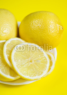 Lemons on the yellow background