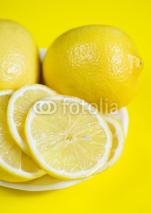 Naklejki Lemons on the yellow background
