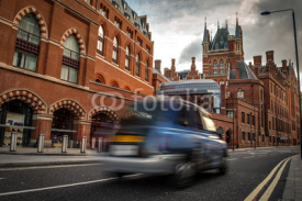 Naklejki Exterior shot of St Pancras international train station and a black cab taxi in London, England, UK