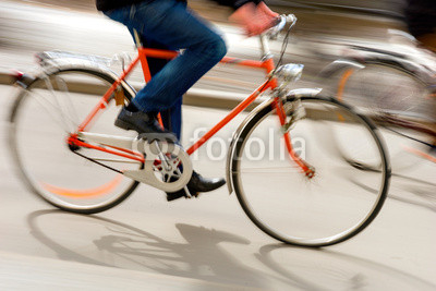 Man on orange bike