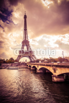 Naklejki Beautiful Eiffel Tower in Paris France under golden light