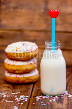 Fototapety Doughnuts and  milk with heart. Focus on milk