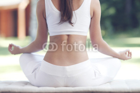 Naklejki Woman doing yoga exercise