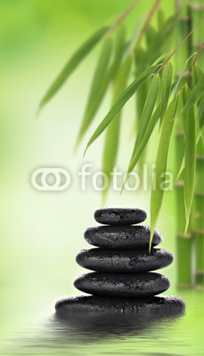Stacked massage stones and bamboo design