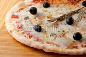 Pizza quattro fromaggi 4 cheese with rosemary on a wooden board