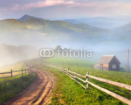 Fototapety Beautiful summer landscape in a mountain village.