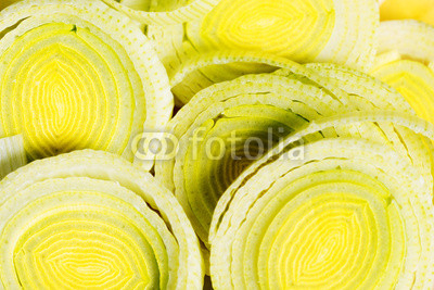 Slices of a green leek. Close up.