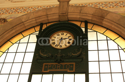 Portugal. Porto. Old clock on  wall station Sao Bento.