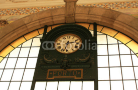 Naklejki Portugal. Porto. Old clock on  wall station Sao Bento.