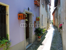 Naklejki  Narrow street of Cannobio. Italy