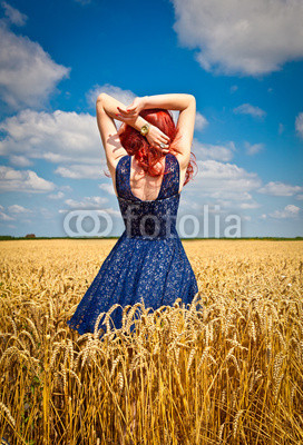 Happy woman in wheat , summer time.