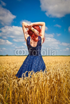 Naklejki Happy woman in wheat , summer time.