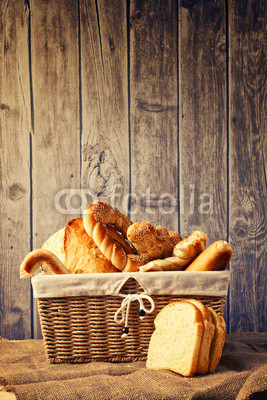 Delicious bread and rolls inwicker basket