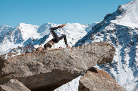 Fototapety Woman is practicing yoga against Kazakhstan mountains.
