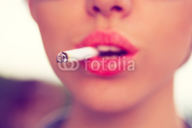 Naklejki woman smoke a cigarette