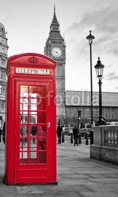 Red phone booth in London with the Big Ben in black and white