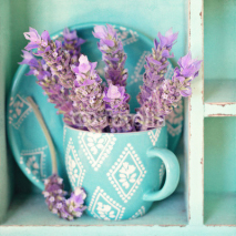 bunch of a lavender flowers in a blue tea mug .
