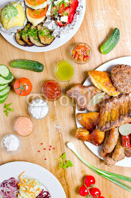 High Angle View of Grilled Meal of Steak, Chicken and Vegetables Spread Out on Rustic Wooden Table