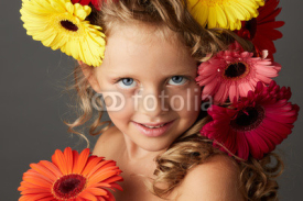 Portrait of a little girl with gerbera daisy