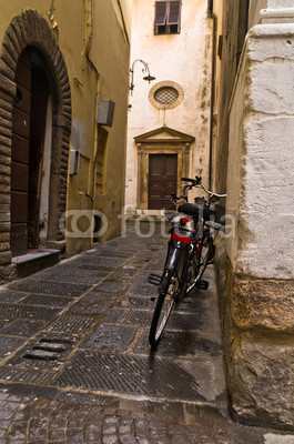 Backstreet with bicycles in Lucca, Tuscany