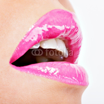 Obrazy i plakaty  Closeup Beautiful female lips with pink  lipstick