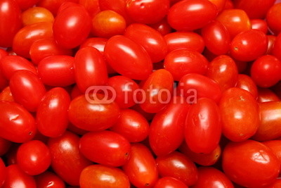 small shiny tomato for red background