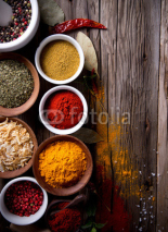 Naklejki Assorted spices on wooden background