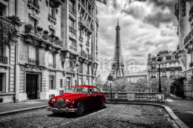 Fototapety Artistic Paris, France. Eiffel Tower seen from the street with red retro limousine car.