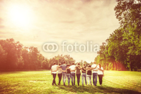 Group of Teenage Friends in the Park at Sunset