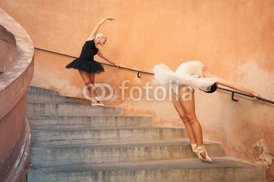 Young beautiful ballerinas dancing on the stairs. 