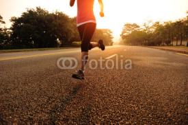 Naklejki Runner athlete running on sunrise road