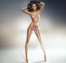 Fototapety Portrait of the sexy woman wearing pink lingerie