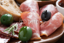 Naklejki assorted Italian antipasti - meats, olives and ciabatta, closeup