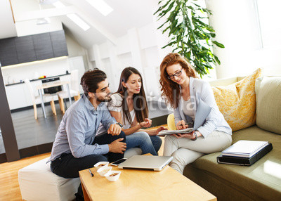 Female Real Estate agent offer home ownership and life insurance to young couple.