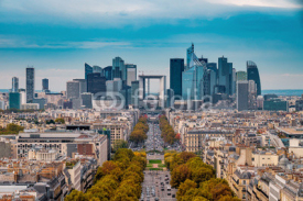 La Defense Financial District Paris France in autumn. Traffic on Champs-Elysees with orange and yellow trees aside. Modern vs. Old architecture. Blue sky