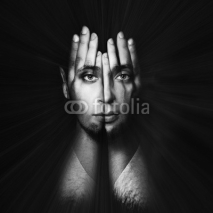 Naklejki Face shines through hands. Double exposure