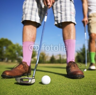 Men playing golf