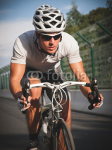 Naklejki Cyclist portrait in action.