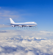 Naklejki passenger airplane in the clouds.