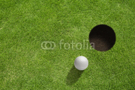 Naklejki Golf ball near the hole