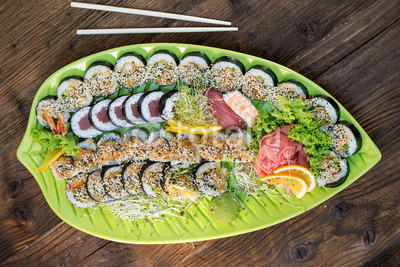 Fresh sushi on green platter