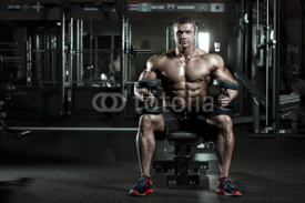 Naklejki very power athletic man in a gym
